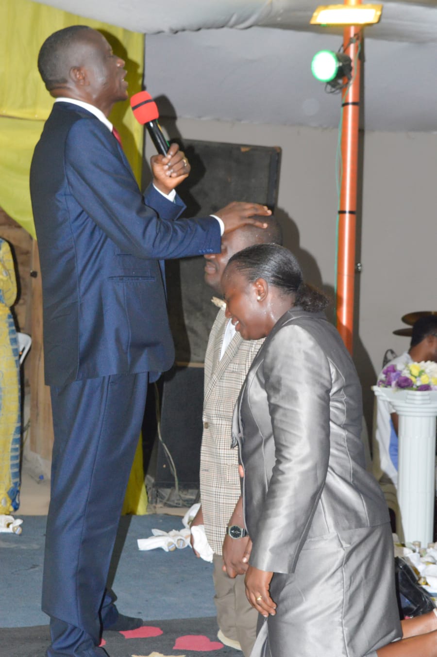 Ministers praying at the altar