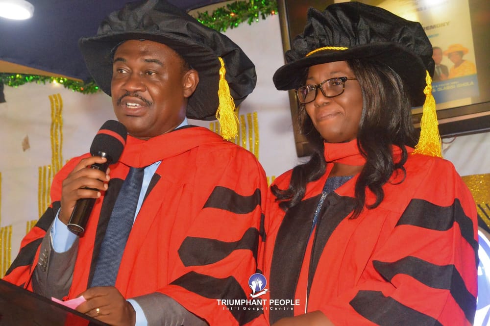 A graduation-style ceremony on stage